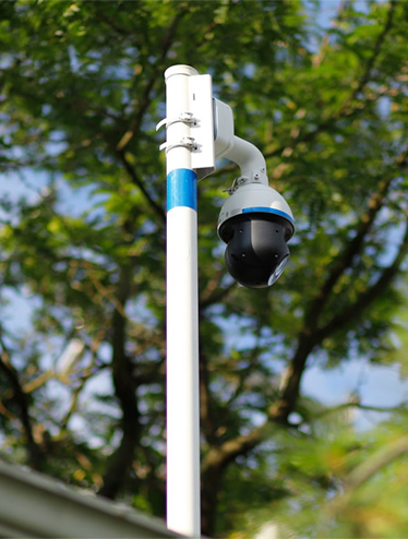 PTZ security camera mounted on a pole outdoors